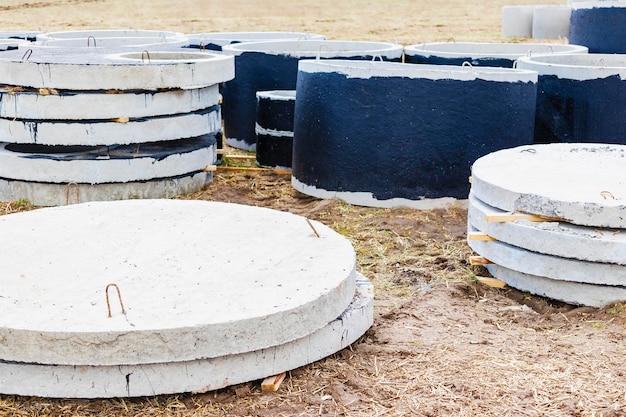 Reinforced concrete rings for the installation of underground wells at the construction site Reinforced concrete products for the device of underground communications Sewerage and plumbing