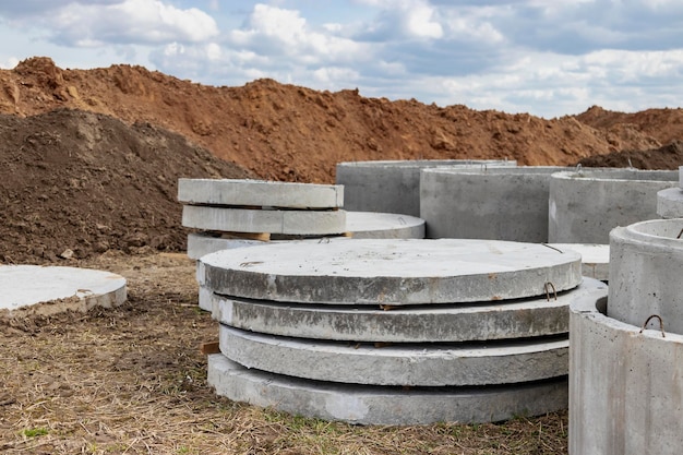 Reinforced concrete rings for the installation of underground wells at the construction site Reinforced concrete products for the device of underground communications Sewerage and plumbing