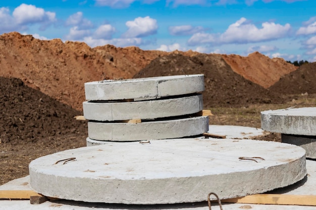 Reinforced concrete rings for the installation of underground wells at the construction site Reinforced concrete products for the device of underground communications Sewerage and plumbing