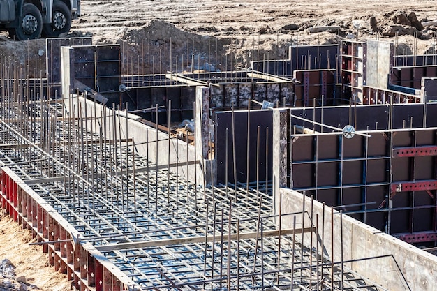 Reinforcement prepared for pouring a reinforced concrete foundation or grillage Preparation of the base for pouring concrete Reinforced concrete monolithic work at an industrial construction site