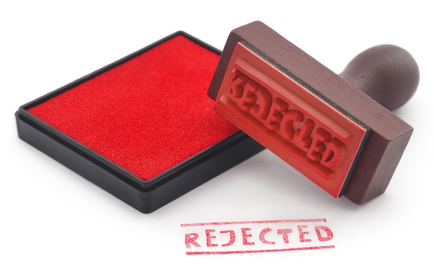 Photo rejected rubber stamp with pad over white