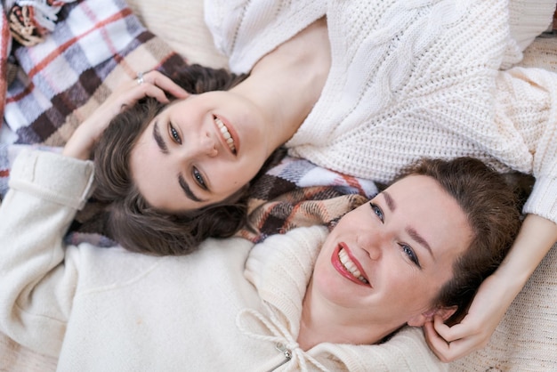 Relax laughing and senior mother and daughter with coffee cup for home