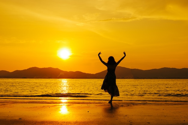 Relax Woman  jumping sea on the beach   