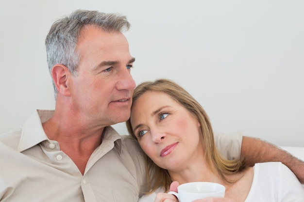 Relaxed loving couple with coffee cup