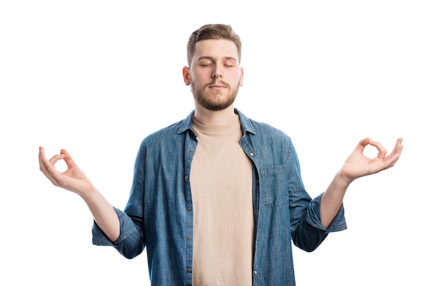 Relaxed peaceful man practicing yoga exercises