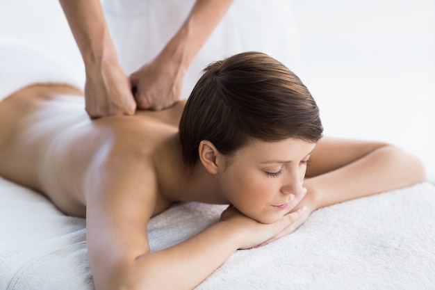 Relaxed woman enjoying back massage