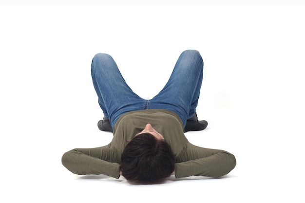 Photo relaxed woman lying on the floor hand on head on white background