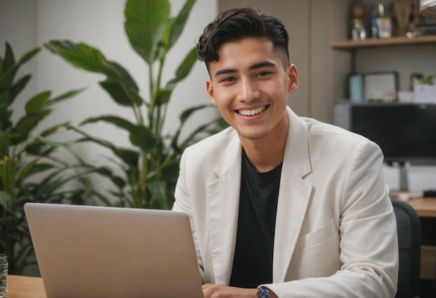 A relaxed young man working on a laptop in a plantfilled office his easygoing nature apparent