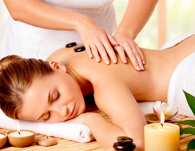 Relaxing massage therapy session with hot stones in a serene spa environment