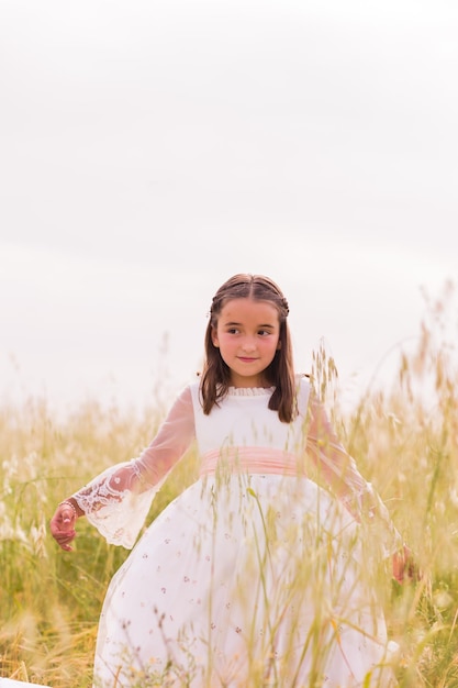 Religious catholic child celebration hispanic girl in communion portrait summer