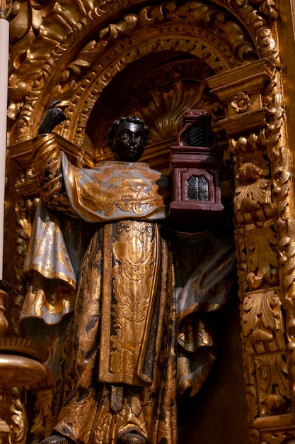 Religious Christian Statue detail on Church of Carmo interior, located in Faro, Portugal.