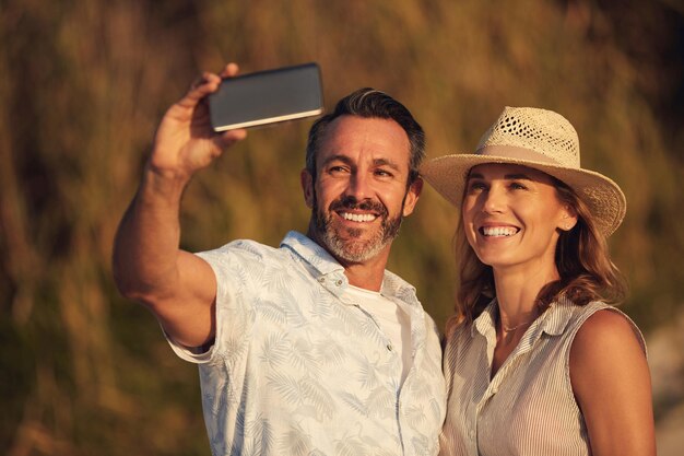 Remember to make visual memories Cropped shot of an affectionate couple taking a selfie together