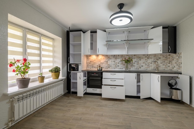 Renovated interior for modern trendy white kitchen with doors open