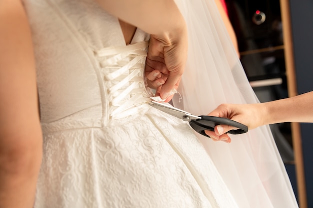 Photo repair of a wedding dress with scissors