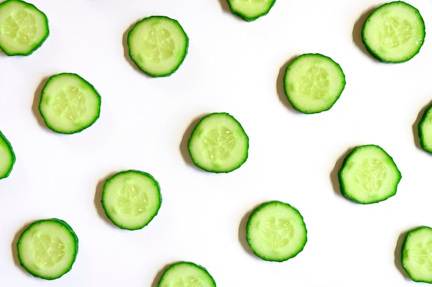 repeating pattern of sliced semicircles of fresh raw vegetable cucumbers for salad