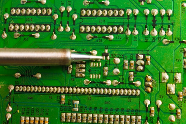 Replacing electronic components and parts with a soldering iron and solder Industrial equipment