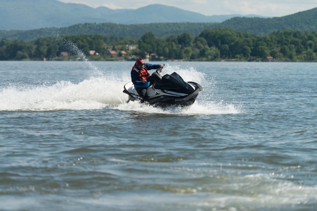 Rescuer Doing Lookout on Ocean by Jet Ski