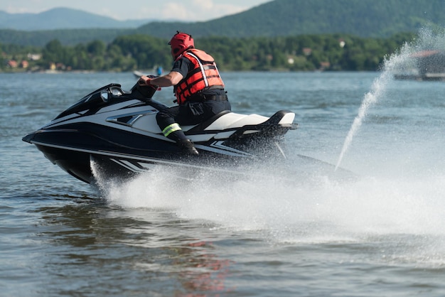 Rescuer Doing Lookout on Ocean by Jet Ski