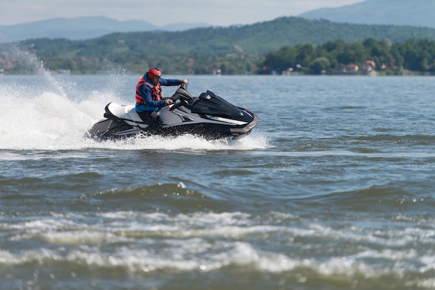 Rescuer Inspecting Ocean Area by Jet Ski