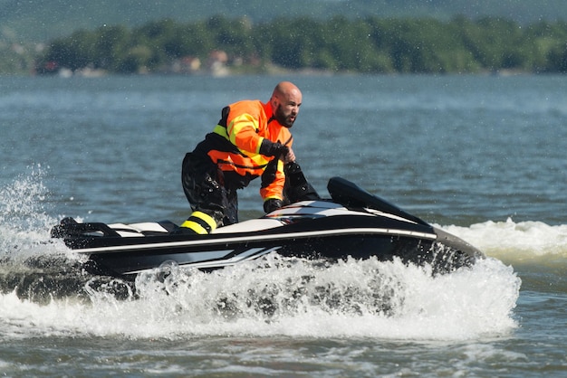 Rescuer Inspecting Ocean Area by Jet Ski