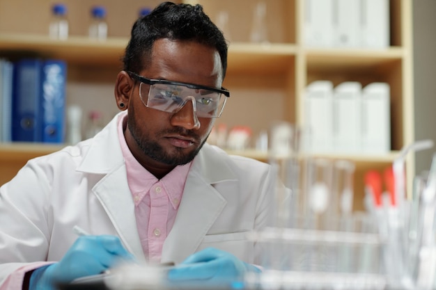 Researcher Checking Reagents