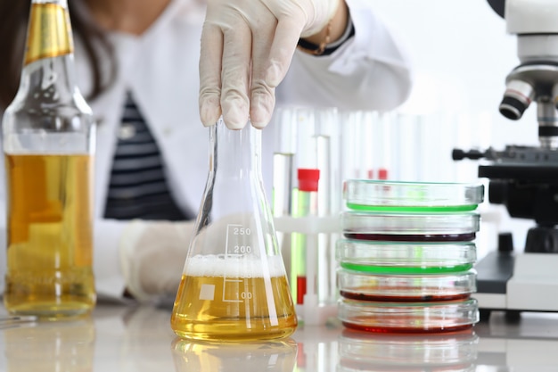 Researcher mixing test tube in lab