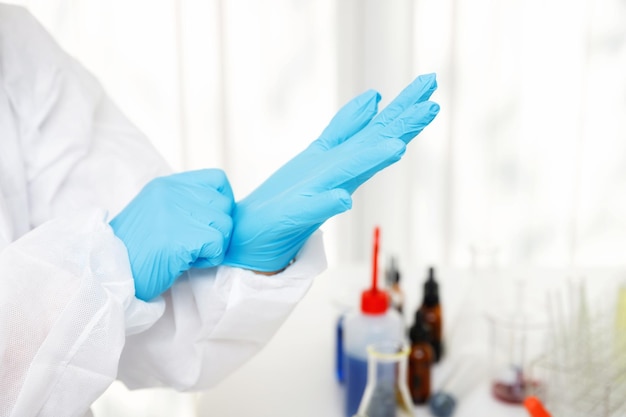 Researcher or scientists wear gloves before working in laboratory