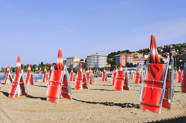 resort town in Slovenian coast. orange sunset sky in summer. Scenic view to wooden pier. Sea