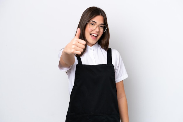 Restaurant Brazilian waiter woman isolated on white background with thumbs up because something good has happened