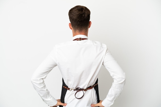 Restaurant caucasian waiter isolated on white background in back position