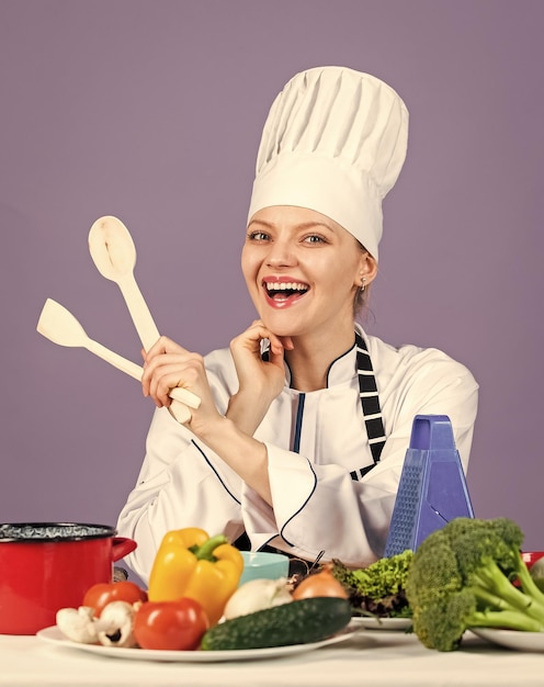 Restaurant kitchen lifestyle happy chef cooking vegetables healthy food and diet woman housewife in cook hat and apron fresh and raw preparing full of vitamin natural and organic