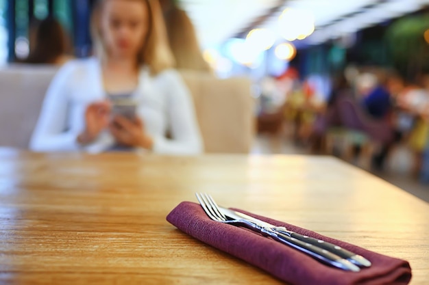 restaurant table setting, fork and knife on the table menu decor