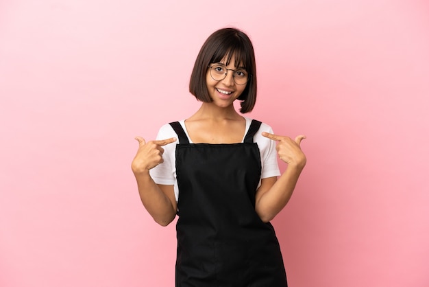 Restaurant waiter over isolated pink background proud and self-satisfied