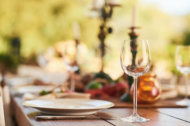 Restaurant wine glass and table for dinner party or thanksgiving celebration with luxury winery and hospitality industry Patio plate and outdoor eating experience for lunch or drink background