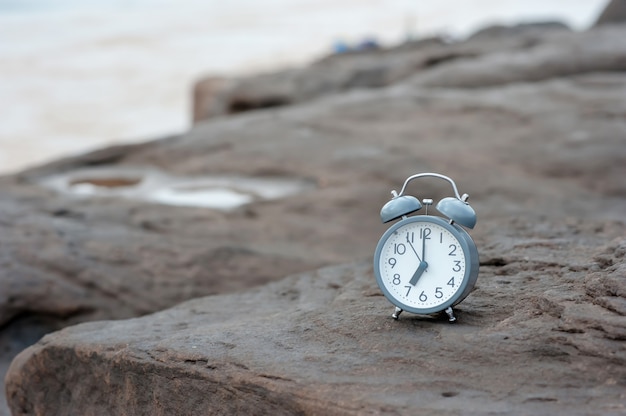 Retro alarm clock of morning and river view