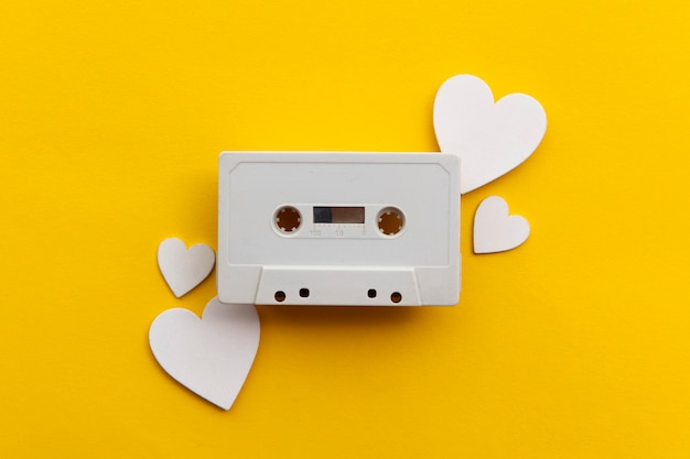 retro audio cassette tape surrounded by white love hearts.