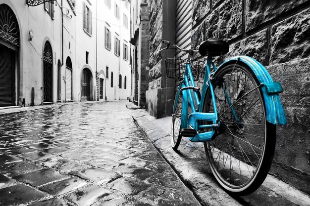 Retro blue bike on old town street