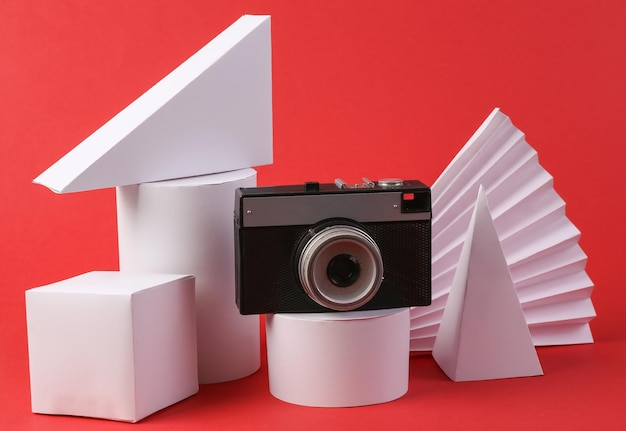 Retro camera and geometric shapes on red background Concept art Retro 80s