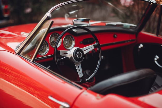 Retro car rally. Red Alfa-Romeo.