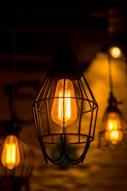 retro Edison light bulb glowing and decor in night