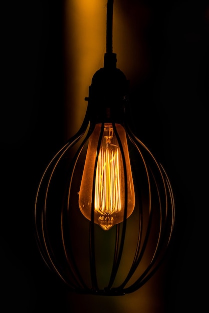 retro Edison light bulb glowing and decor in night