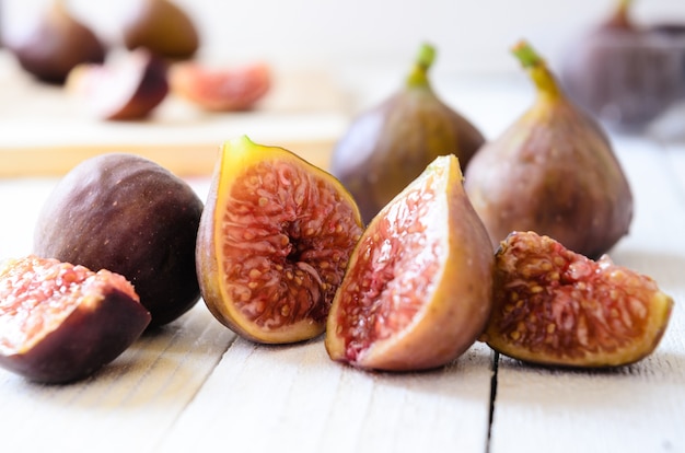 Retro Figs on white wooden boards, selective focus