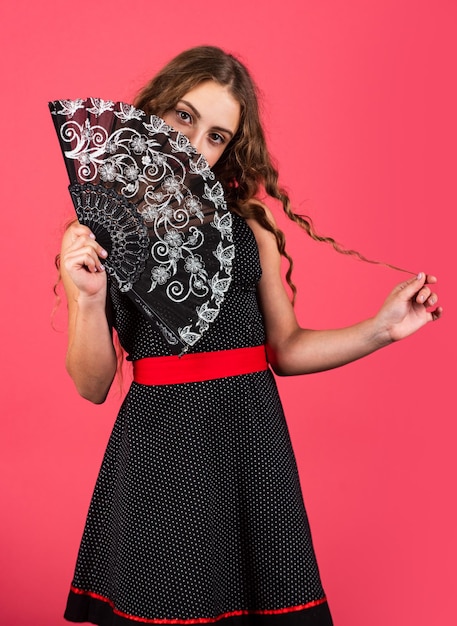 Retro girl use fan true lady cover her face vintage portrait carnival or masquerade theatre performance concept spanish dance attribute summer fan accessory looking gorgeous Air circulation