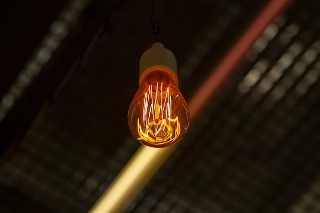 Retro light bulb Edison. Designer lamp of Edison. Designer light and lighting in interiors. 