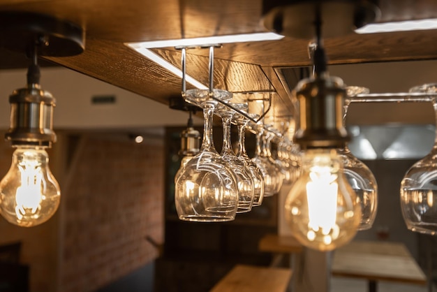 Retro light bulbs hanging in department store with decorate interior luxury fixtures combine beautiful modernity Designer lamps on the ceiling beautifully laid out