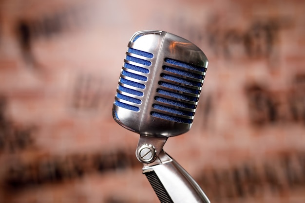 Retro microphone on stage in a pub or bar, restaurant during a night show.