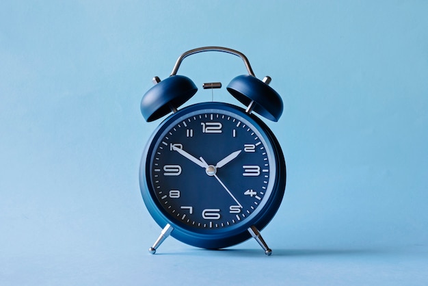 Retro style blue alarm clock with bells