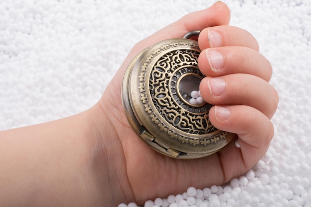 Retro style pocket watch in hand