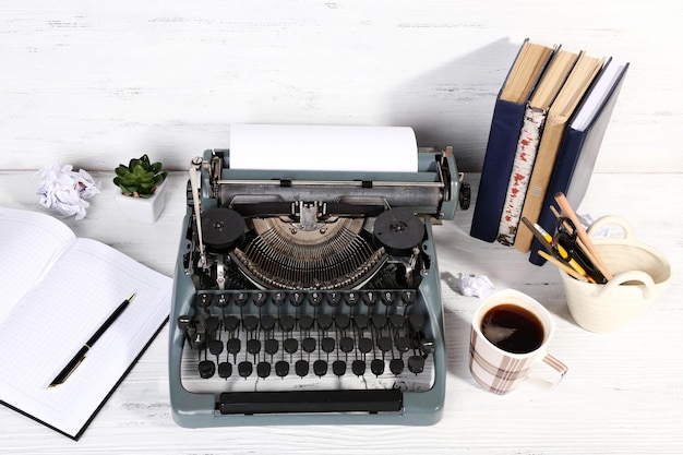 Retro typewriter on wooden background