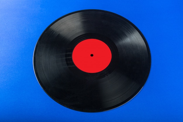 Retro vinyl record on blue background